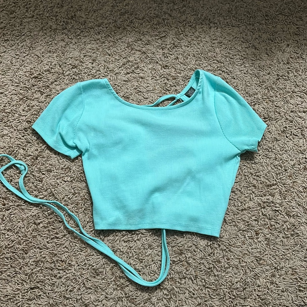 teal cropped top with open back